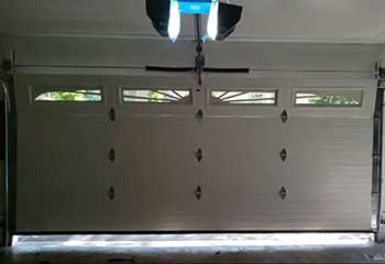 Close-up of Chamberlain opener installed on garage ceiling in Altadena, CA
