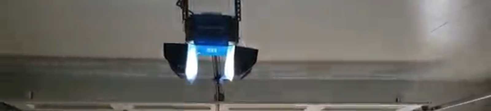 Close-up of Chamberlain opener installed on garage ceiling in Altadena, CA